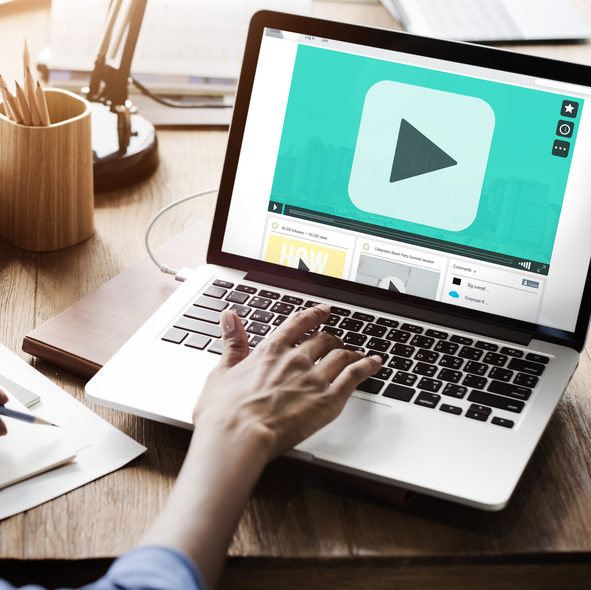 woman at computer watching video